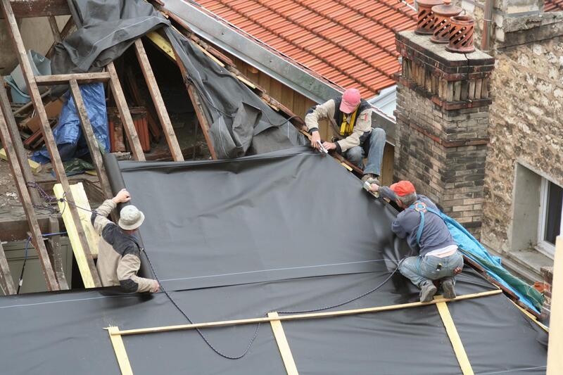 3 Men Working on replacing a sub roof and going to re shingle For Delaware County Roofers